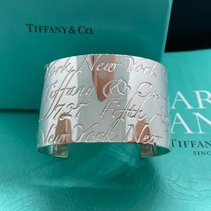 Tiffany & Co. wide notes script bracelet cuff